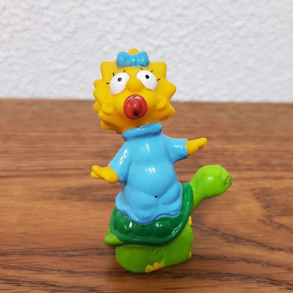 Toy Vintage Rubber Figure - The Simpsons Maggie Riding a Turtle - 3" Tall - 1990